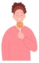 Young woman with sweet spiral lollypop candy. Yummy dessert