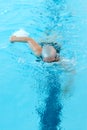 Young woman swim on indoor pool. freestyle mode.