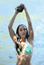Young woman swim suit water pouring on head