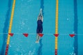 Young woman swimmer swims in swimming pool Royalty Free Stock Photo