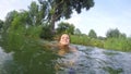 Young woman swimming in the lake in slow motion. 1920x1080