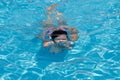 Young woman swimming in a pool