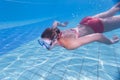 young woman swimming underwater in a pool Royalty Free Stock Photo