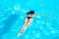 Young Woman Swimming Underwater in Swimming Pool. Summer Vacation Royalty Free Stock Photo