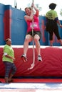 Young Woman Swings With Rope In Crazy Obstacle Race