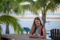 Young woman with tablet on the beach Royalty Free Stock Photo