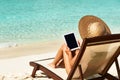 Young woman with tablet pc at the beach Royalty Free Stock Photo