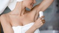 Young woman take care of armpit use dry antiperspirant