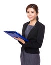 Young woman take note on clipboard Royalty Free Stock Photo