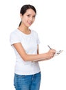 Young woman take note on clipboard Royalty Free Stock Photo