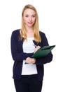 Young Woman take note on clipboard Royalty Free Stock Photo