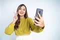 young woman take a selfie with peace hands gesture