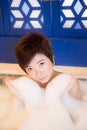 Young woman takes bubble bath Royalty Free Stock Photo