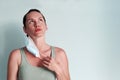 A young woman takes off her medical mask breathing in the air with relief. Copispace