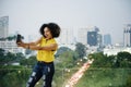 Young woman taking a cute selfie in the cityscape