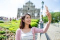 Young woman taking mobile phone in Macau city Royalty Free Stock Photo