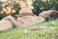 Young woman taking a nap in park Royalty Free Stock Photo