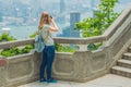 Young woman taking photos of victoria harbor in Hong Kong, China Royalty Free Stock Photo