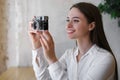 Young woman taking picture at cafe. Creative hobby Royalty Free Stock Photo