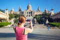 Young woman taking picture of Catalan Art Museum (MNAC) Royalty Free Stock Photo