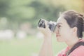 A young woman taking pictures outdoors Royalty Free Stock Photo