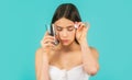 Young woman taking pill against headache. Brunette taking a pill with a glass of water. Woman taking drugs to releave Royalty Free Stock Photo