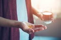 Young woman taking pills Royalty Free Stock Photo