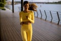 Young woman taking running exercise by the river promenade