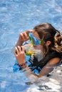 Young woman taking a scuba diving lesson in a resort pool Royalty Free Stock Photo