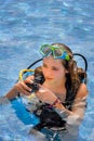 Young woman taking a scuba diving lesson in a resort pool Royalty Free Stock Photo