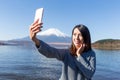 Young Woman taking selfie with cellphone Royalty Free Stock Photo