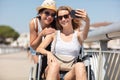 young woman taking selfie with friend in wheelchair Royalty Free Stock Photo