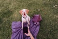 young woman taking a selfie with mobile phone with her dog at the park. autumn season Royalty Free Stock Photo