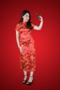 Young woman takes photo with cheongsam dress