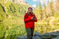 Shot of a young lost woman looking at the phone, hiking mountains. Travel and hobby concept. Royalty Free Stock Photo