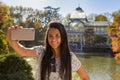 Young woman taking a selfie in Retiro park, Madrid