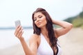 Young woman taking selfie with smartphone Royalty Free Stock Photo