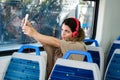 Young woman taking a selfie on train with her phone Royalty Free Stock Photo