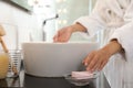 Young woman taking soap bar to wash hands Royalty Free Stock Photo