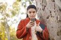 Young woman talking mobile phone in outdoors Royalty Free Stock Photo