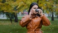 Young woman talking on phone with her boyfriend agrees meet cheerful beautiful girl resting on weekend in park drinking Royalty Free Stock Photo