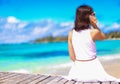 Young woman talking on phone during tropical beach Royalty Free Stock Photo