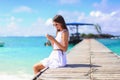 Young woman talking on phone during tropical beach Royalty Free Stock Photo