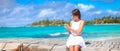 Young woman talking on phone during tropical beach Royalty Free Stock Photo