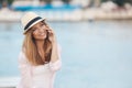 Young woman talking on phone during tropical beach vacation Royalty Free Stock Photo