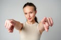 Young Woman in Tank Top Pointing at Camera