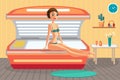 Young woman tanning in solarium in spa salon. Royalty Free Stock Photo