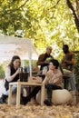 Young woman tasting natural organic wine at farmers market