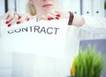 Angry woman tears agreement documents in front of camera closeup. Royalty Free Stock Photo