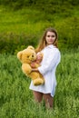Young woman with teddy bear. Royalty Free Stock Photo